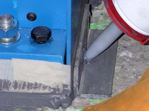 Jacking bolts used to lift equipment while Belzona is applied